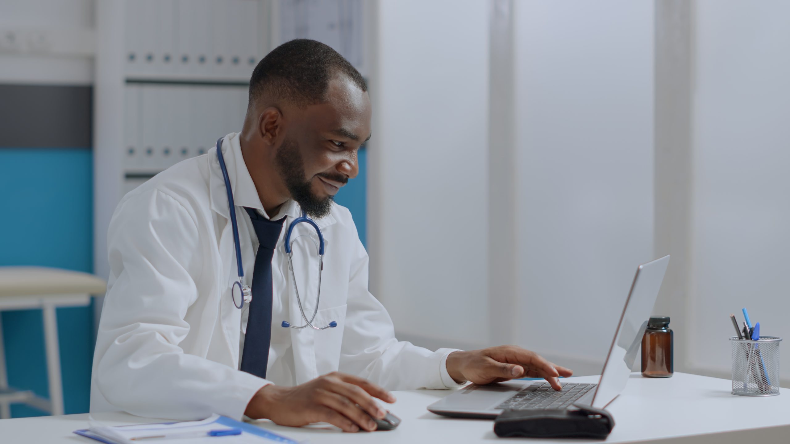 Doctor reviewing medical and financial information