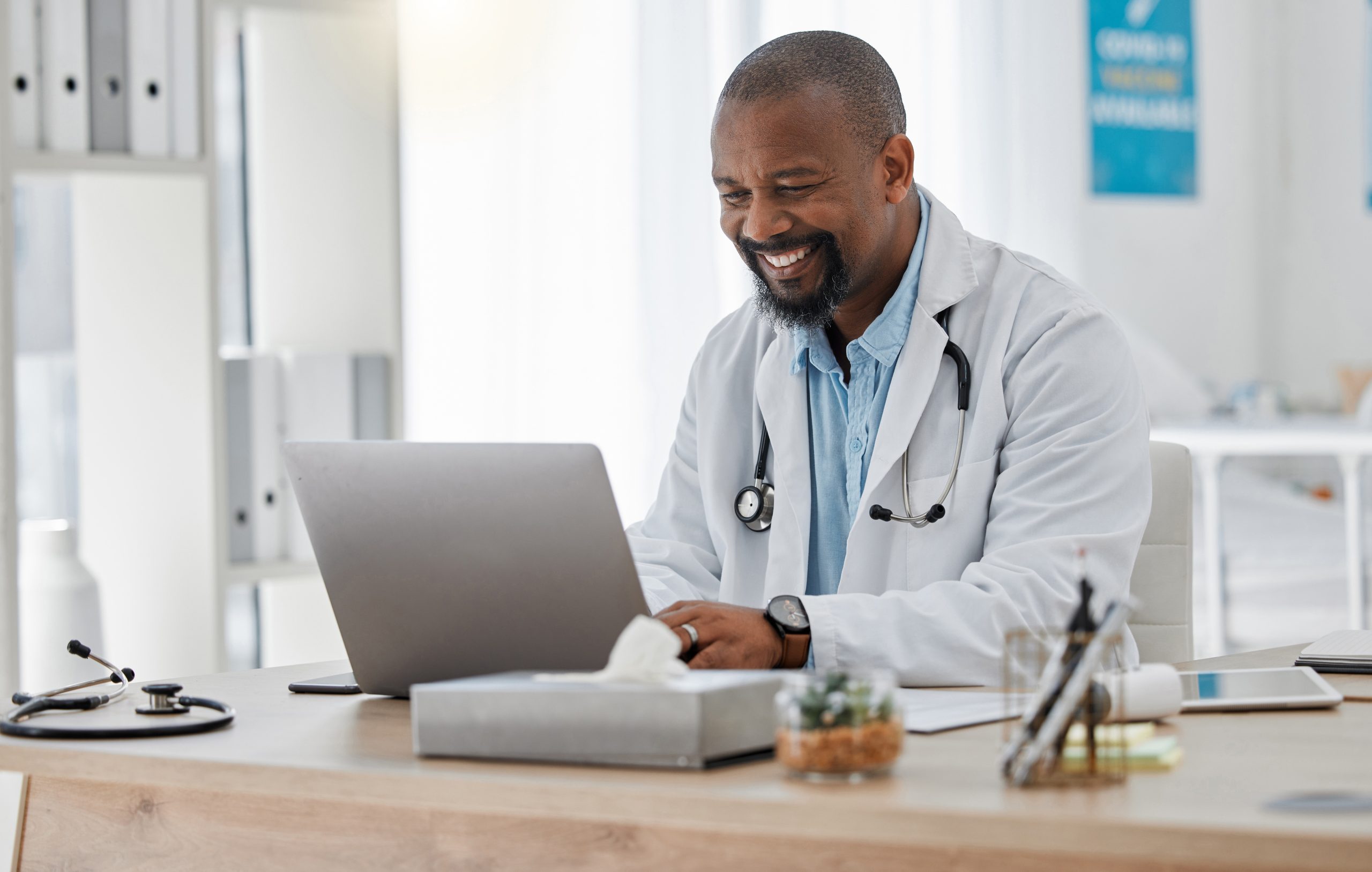 Doctor managing medical records and practice information