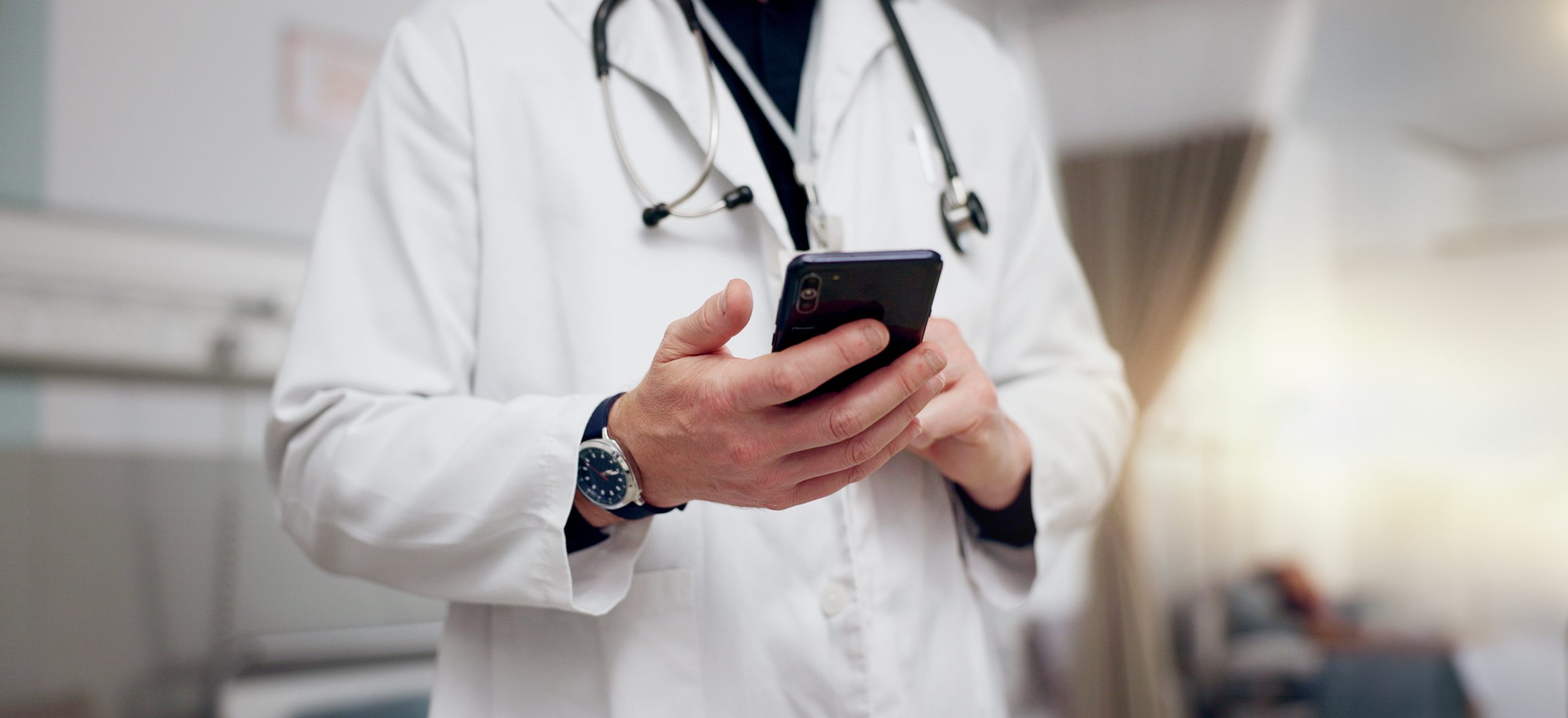 Medical professional using technology to manage practice responsibilities